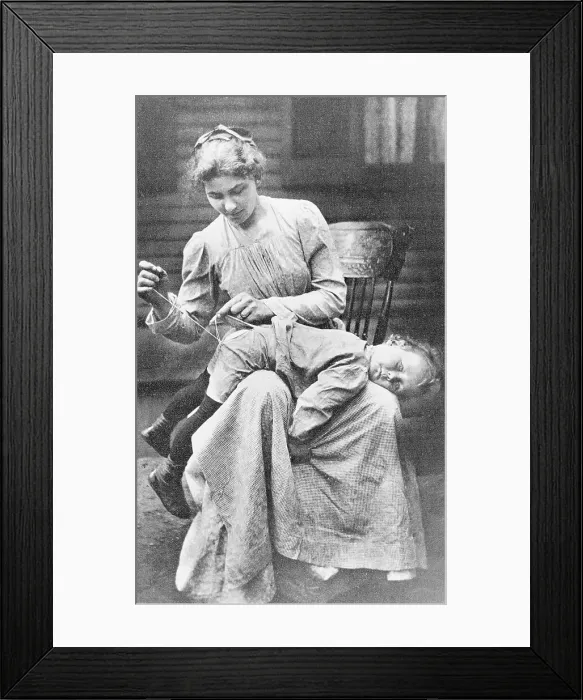 Framed Print : Mother Mending Son's Pants Framed Print : Mother Mending Son's Pants