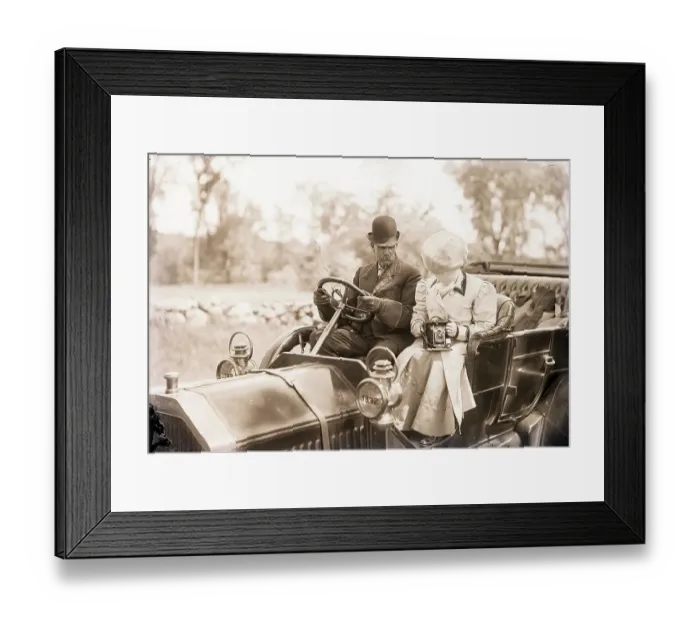 Framed Print : Man Drives Auto While Woman Snaps Photo Framed Print : Man Drives Auto While Woman Snaps Photo