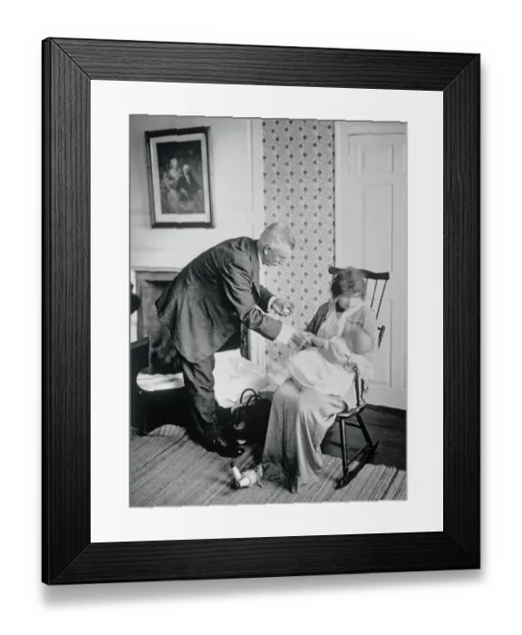 Framed Print : Doctor Feeling Infant's Pulse Framed Print : Doctor Feeling Infant's Pulse