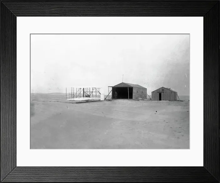 Framed Print : Early Wright Brothers Airplane Parked Near Buildings Framed Print : Early Wright Brothers Airplane Parked Near Buildings