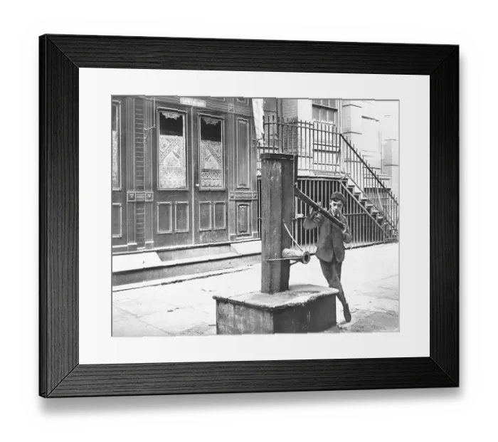 Framed Print : Boy Examining Old Water Pump Framed Print : Boy Examining Old Water Pump