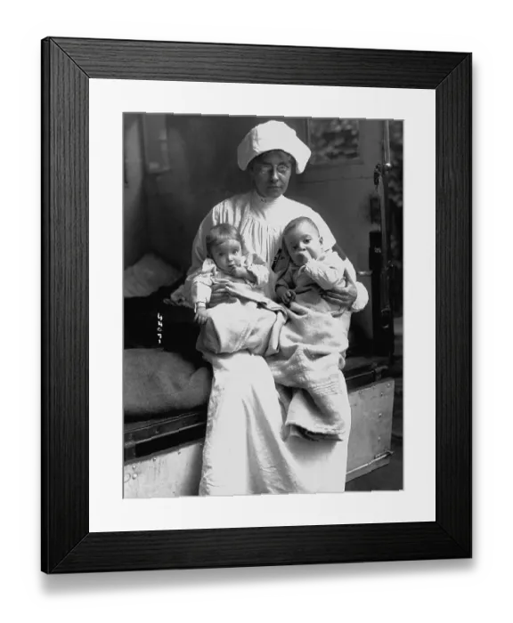Framed Print : Nurse Holding Two Infants Framed Print : Nurse Holding Two Infants
