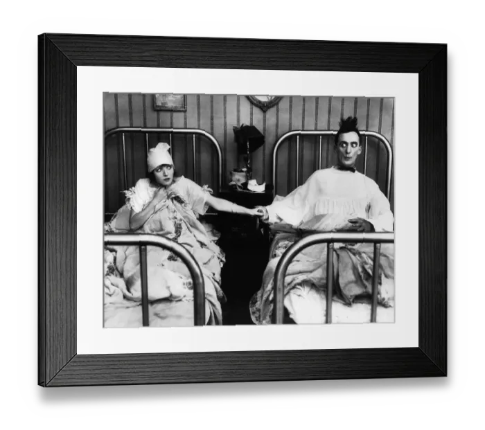 Framed Print : Nervous Couple Holding Hands in Bed Framed Print : Nervous Couple Holding Hands in Bed