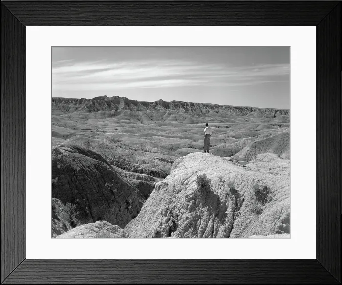 Framed Print : Man Overlooks The Badlands Framed Print : Man Overlooks The Badlands