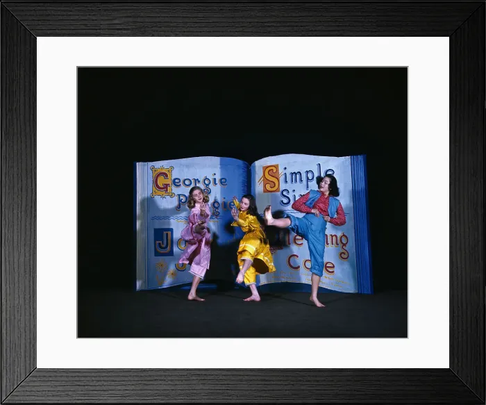 Framed Print : Three Young Women Dancing in Front of Large Prop Framed Print : Three Young Women Dancing in Front of Large Prop