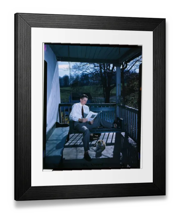 Framed Print : Young Farmer Reading a Magazine Framed Print : Young Farmer Reading a Magazine