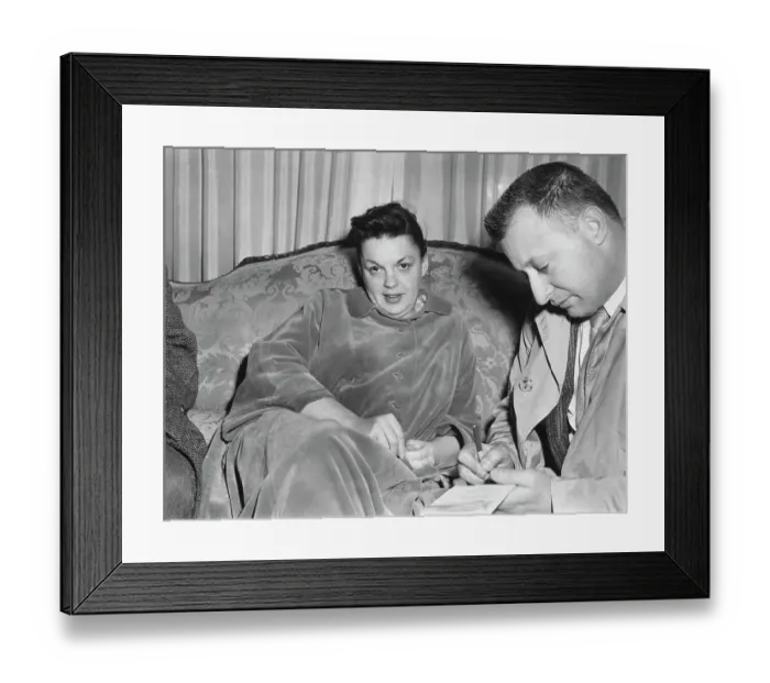 Framed Print : Judy Garland Sitting on Couch Framed Print : Judy Garland Sitting on Couch