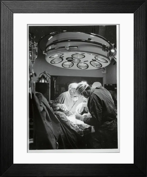 Framed Print : Doctors Performing Surgery in Operating Room Framed Print : Doctors Performing Surgery in Operating Room