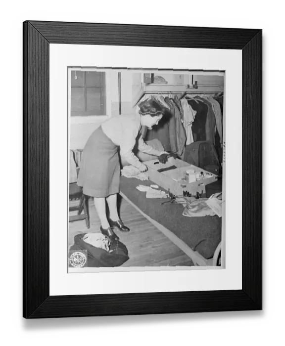 Framed Print : Female Soldier Organizing Her Goods from Luggage Framed Print : Female Soldier Organizing Her Goods from Luggage