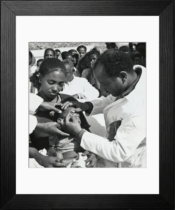 Framed Print : Medical Personnel Examining Young Child Framed Print : Medical Personnel Examining Young Child