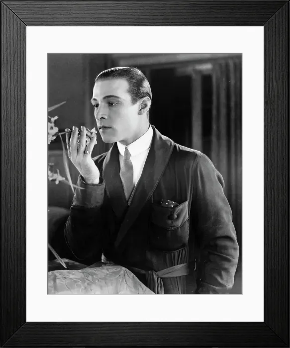Framed Print : Rudolph Valentino Holding a Flower Framed Print : Rudolph Valentino Holding a Flower