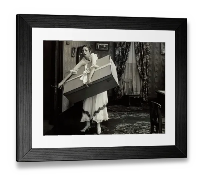 Framed Print : Woman Carrying Wrapped Present Framed Print : Woman Carrying Wrapped Present
