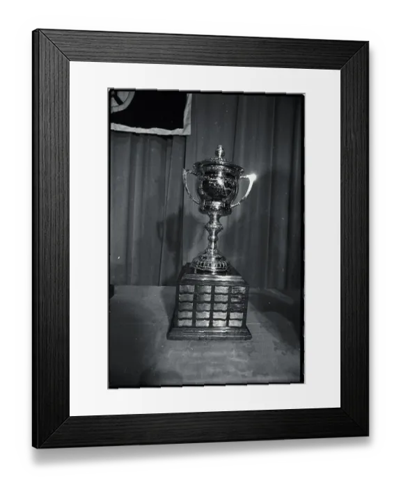 Framed Print : Hockey Trophy Standing on Table