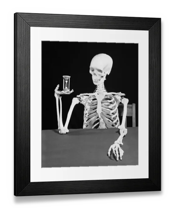 Framed Print : Skeleton Holding Hourglass Framed Print : Skeleton Holding Hourglass