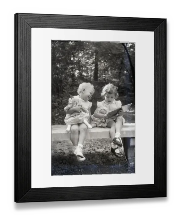 Framed Print : Two Little Girls Sitting On A Bench Framed Print : Two Little Girls Sitting On A Bench