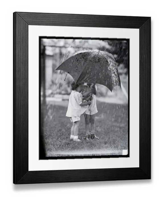 Framed Print : Children Under Umbrella During Rainstorm Framed Print : Children Under Umbrella During Rainstorm