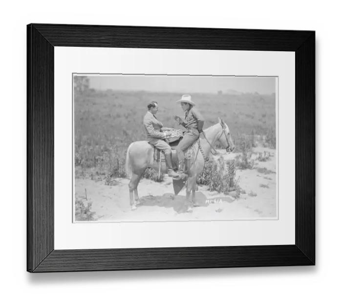Framed Print : Ken Maynard and Al Rogell Playing Checkers Atop Horse Framed Print : Ken Maynard and Al Rogell Playing Checkers Atop Horse