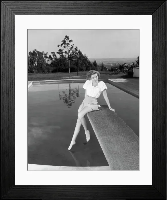 Framed Print : Judy Garland Posing On Diving Board Framed Print : Judy Garland Posing On Diving Board
