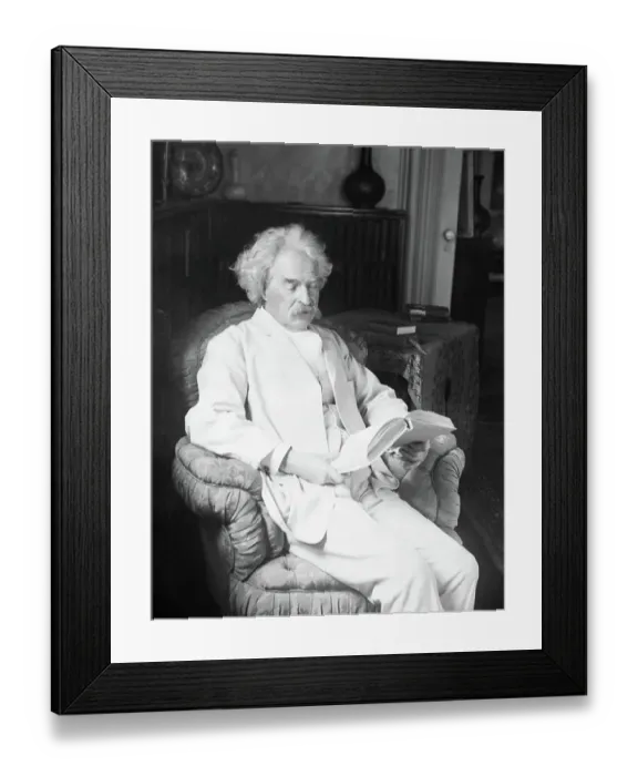 Framed Print : Mark Twain Reading A Book In Easy Chair Framed Print : Mark Twain Reading A Book In Easy Chair