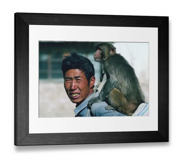 Framed Print : Tibetan Man Carrying Monkey on Back Framed Print : Tibetan Man Carrying Monkey on Back