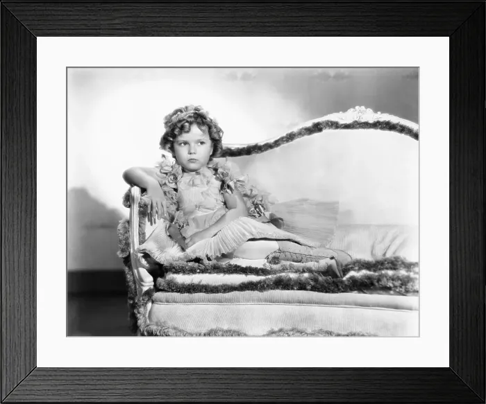 Framed Print : Shirley Temple Sitting On A Couch Framed Print : Shirley Temple Sitting On A Couch