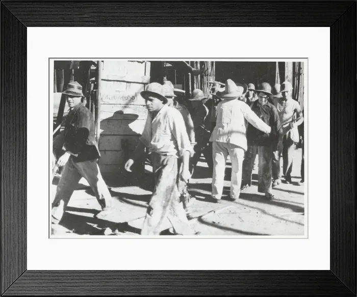 Framed Print : Guard Frisking Workers Framed Print : Guard Frisking Workers