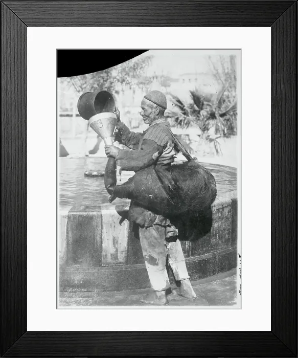 Framed Print : Worker Filling Pigskin with Water