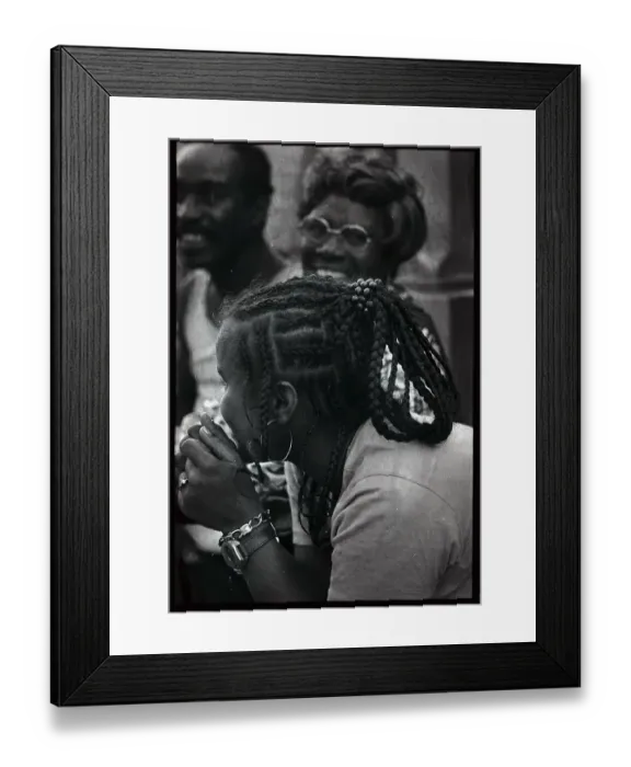 Framed Print : Young Black Woman Leaning over While in Conversation Framed Print : Young Black Woman Leaning over While in Conversation