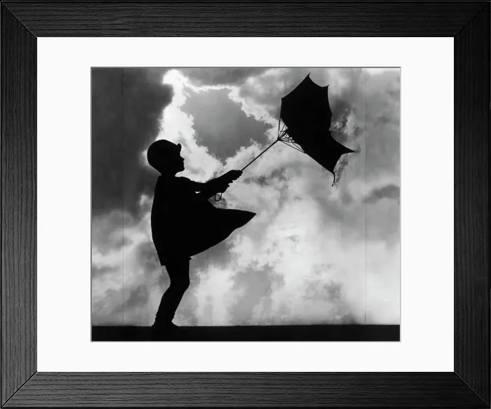 Framed Print : Girl Holding Windswept Umbrella Framed Print : Girl Holding Windswept Umbrella