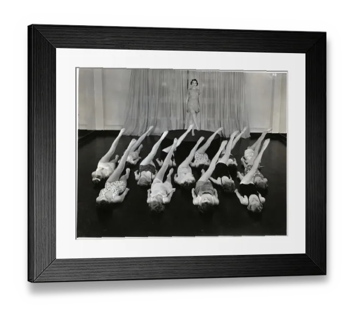 Framed Print : Women Lying In Rows Doing Leg Lifts Framed Print : Women Lying In Rows Doing Leg Lifts