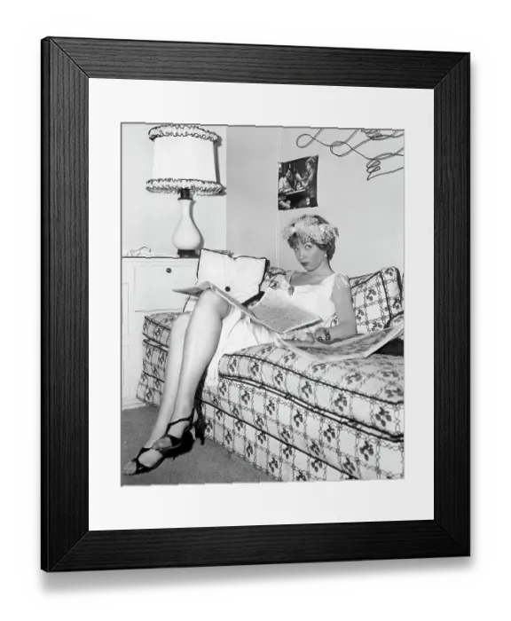 Framed Print : Shirley Maclaine Reads The Newspaper Framed Print : Shirley Maclaine Reads The Newspaper