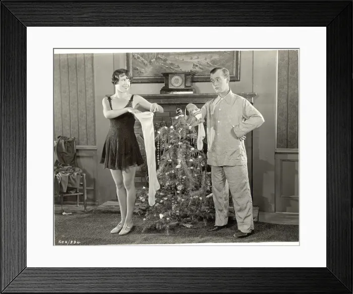 Framed Print : A Couple Compares Christmas Stockings Framed Print : A Couple Compares Christmas Stockings