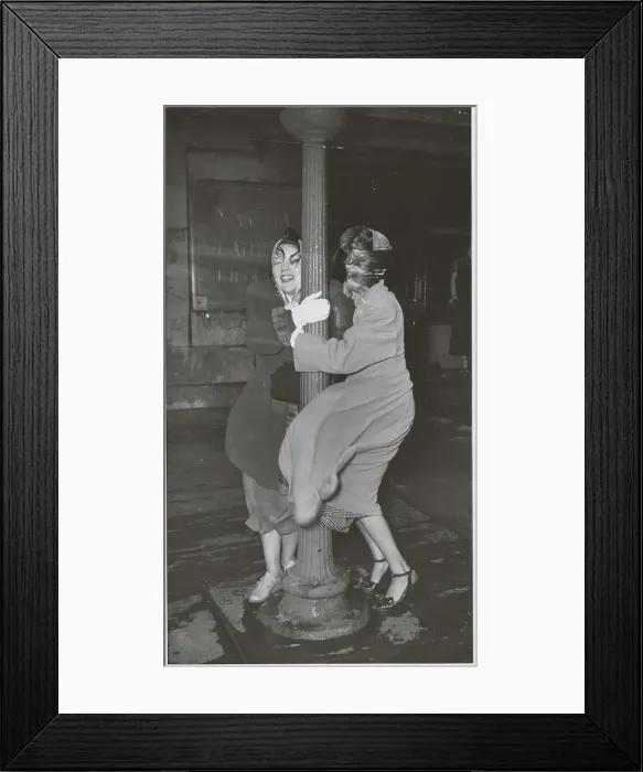 Framed Print : Women Using Pole for Support