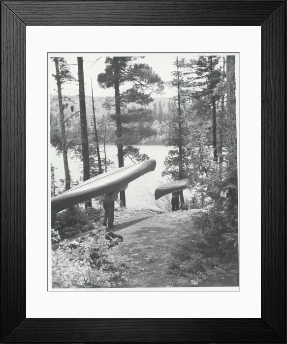 Framed Print : Men Carrying Canoes to River Framed Print : Men Carrying Canoes to River