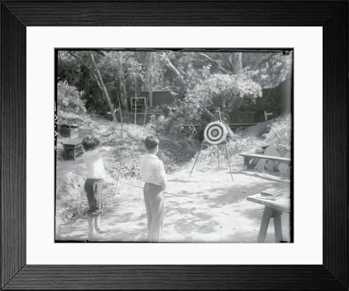Framed Print : Boy Taking Aim with Bow and Arrow Framed Print : Boy Taking Aim with Bow and Arrow