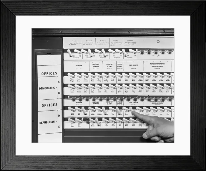 Framed Print : Hand Pushing Lever in Voting Booth Framed Print : Hand Pushing Lever in Voting Booth