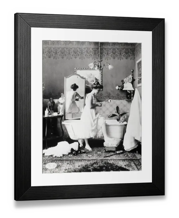 Framed Print : Woman Adding Bath Salts To Bath Water Framed Print : Woman Adding Bath Salts To Bath Water