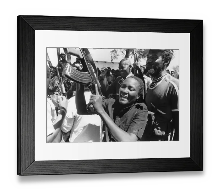 Framed Print : Woman Brandishes Rifle Before Crowd Framed Print : Woman Brandishes Rifle Before Crowd