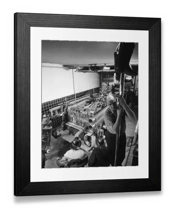 Framed Print : Fireman Sliding Down Fire Station Chute Framed Print : Fireman Sliding Down Fire Station Chute