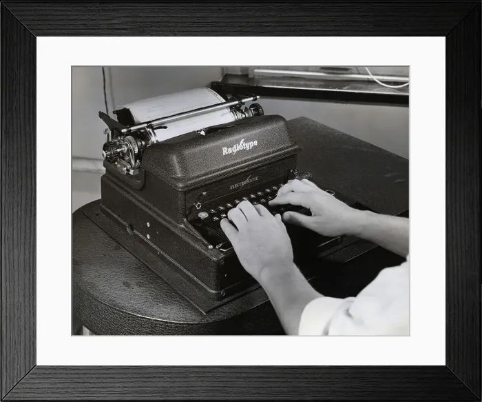 Framed Print : Hands Operating An Ibm Radiotype Machine
