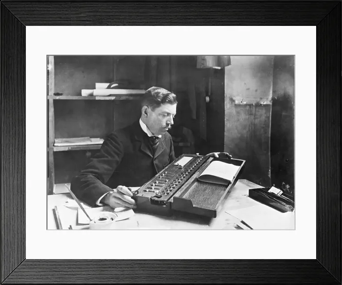 Framed Print : Man Using Calculating Machine Framed Print : Man Using Calculating Machine