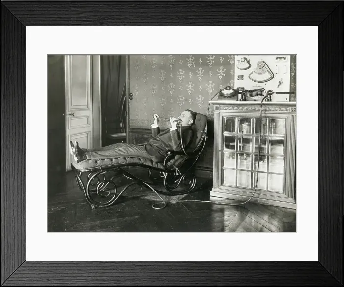 Framed Print : Reclining Man Holding Condenser Rod Framed Print : Reclining Man Holding Condenser Rod