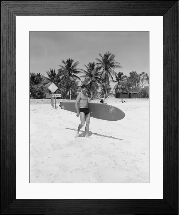 Framed Print : Seaman Carrying Surfboard to Water Framed Print : Seaman Carrying Surfboard to Water