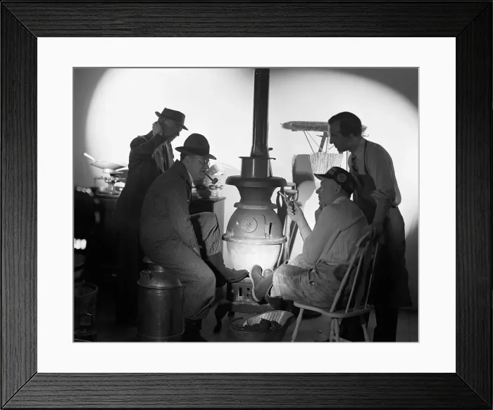 Framed Print : Men Seated In Front Of Potbellied Stove Framed Print : Men Seated In Front Of Potbellied Stove