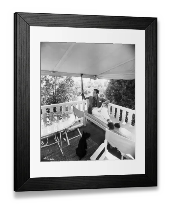 Framed Print : Humphrey Bogart Lounging And Pet On Deck Framed Print : Humphrey Bogart Lounging And Pet On Deck