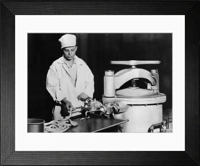 Framed Print : Man Packing Meat in Factory Framed Print : Man Packing Meat in Factory