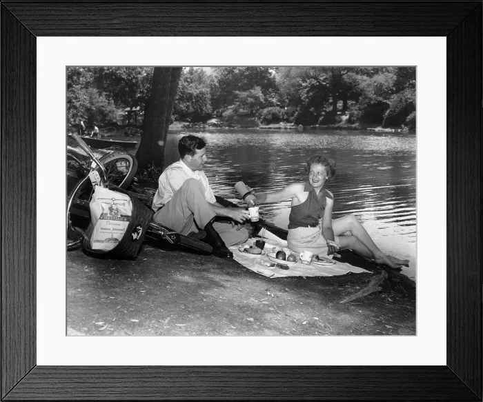 Framed Print : Couple having picnic in park Framed Print : Couple having picnic in park