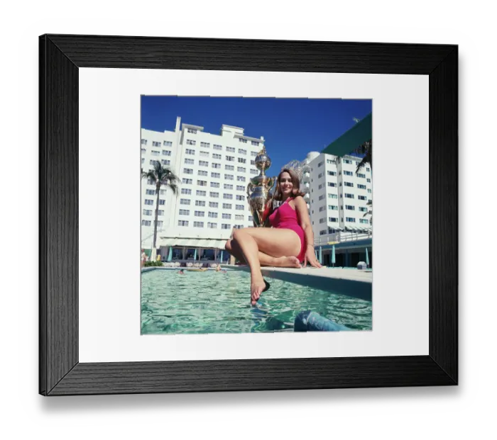 Framed Print : Sylvia Hitchcock Relaxing above Swimming Pool