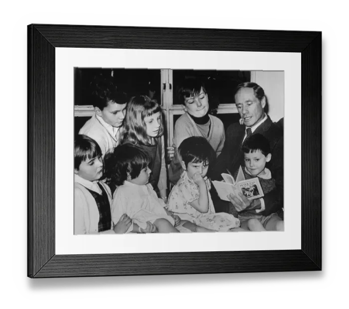 Framed Print : Mel Ferrer Reading to Children