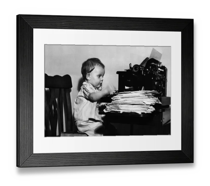 Framed Print : Baby boy (2-3 years) typing on typewriter Framed Print : Baby boy (2-3 years) typing on typewriter